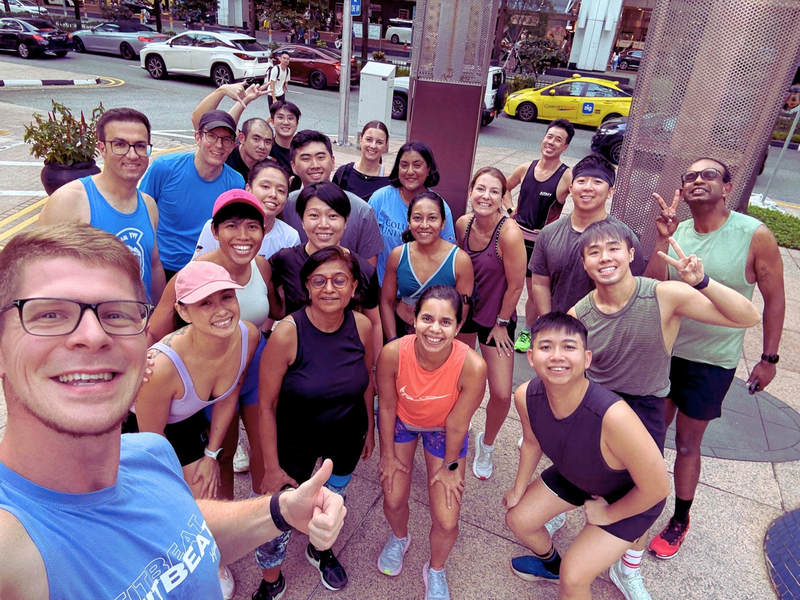 A large FitBeat group photo on the street after a run social